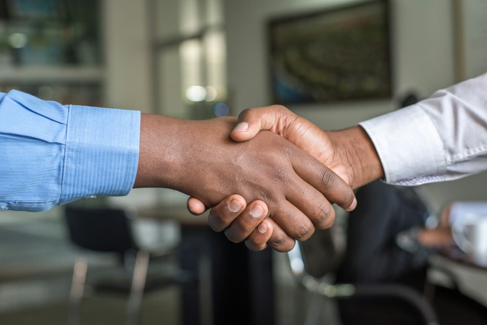 A EligantWealth relationship manager greeting a client